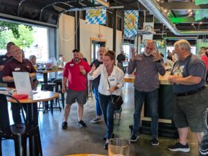 People gathered talking to each other at a Biz Exchange After Hours event